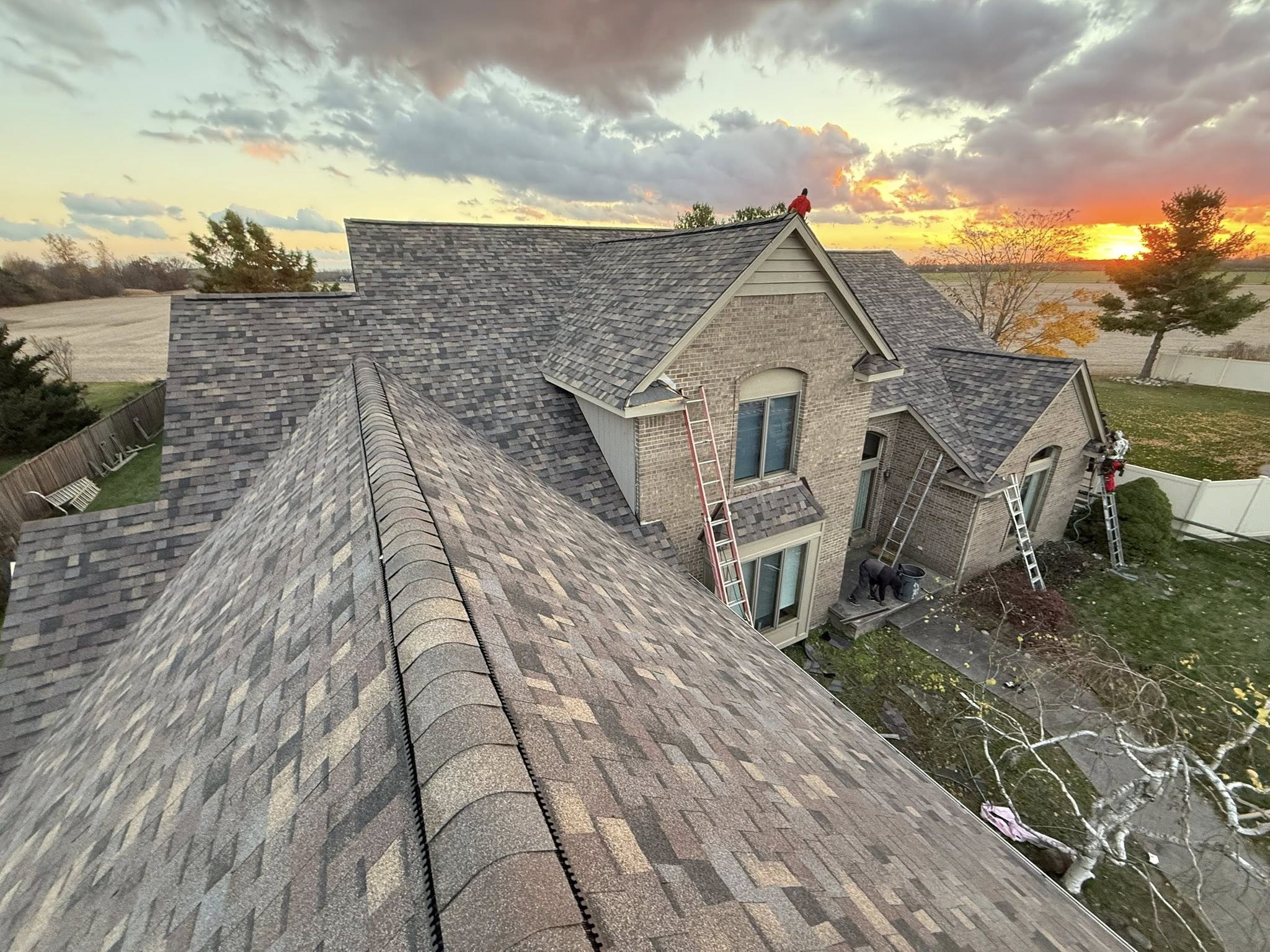 Roofing crew working on a home in Carleton, MI